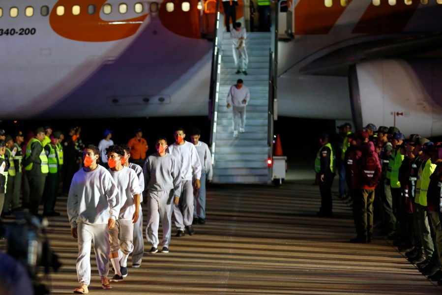 FILE - Venezuelan migrants deported from the United States deplane at the Simon Bolivar International Airport in Maiquetia, Venezuela, Feb. 20, 2025. (AP Photo/Cristian Hernandez, File)