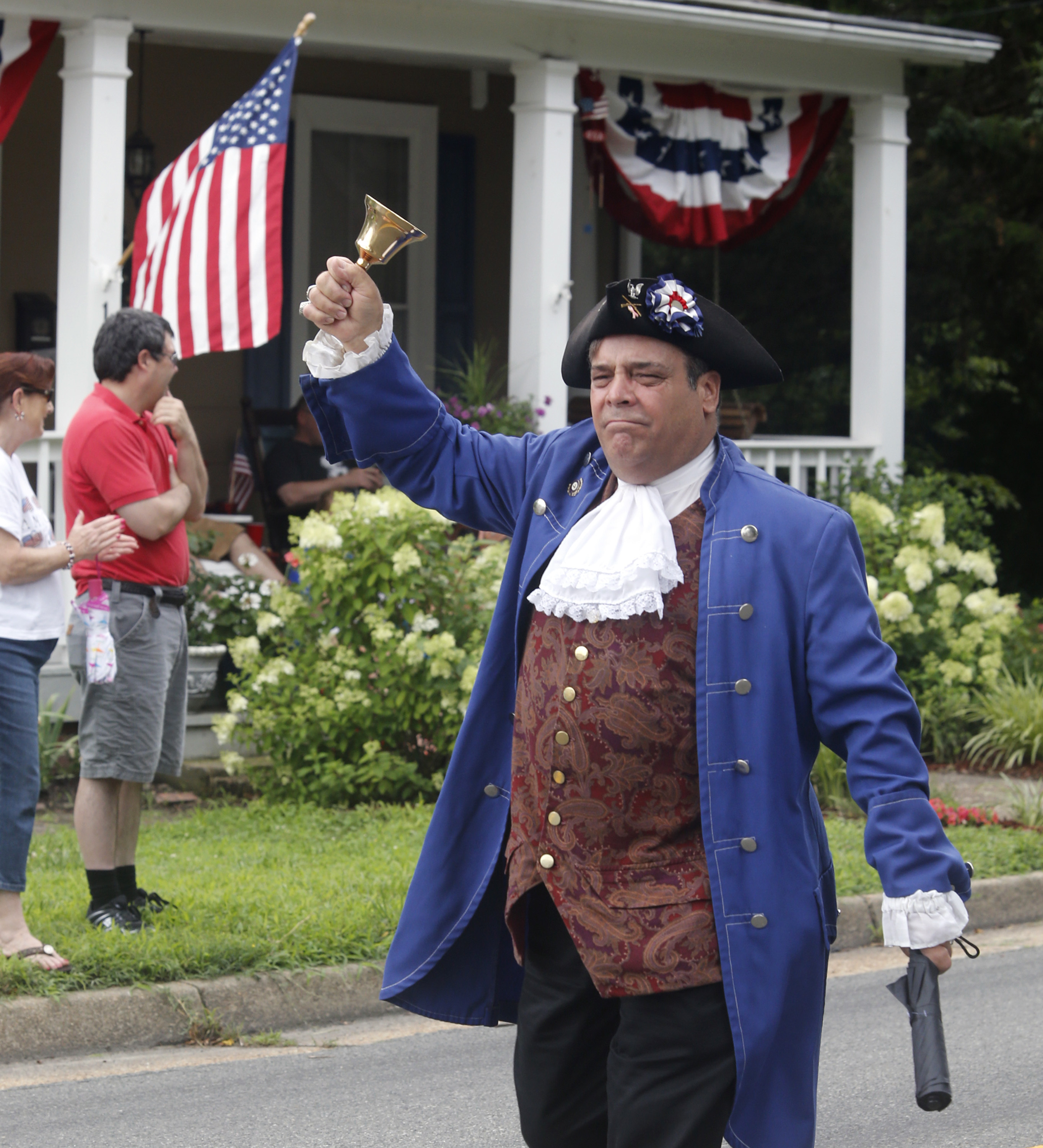 FILE - Ashland, Va. resident John Wallmeyer portraying parriot and native-son Patrick Henry, marches during the annual 4th of July parade in Ashland, Virginia, on July 4, 2015. (Joe Mahoney/Richmond Times-Dispatch via AP, File)