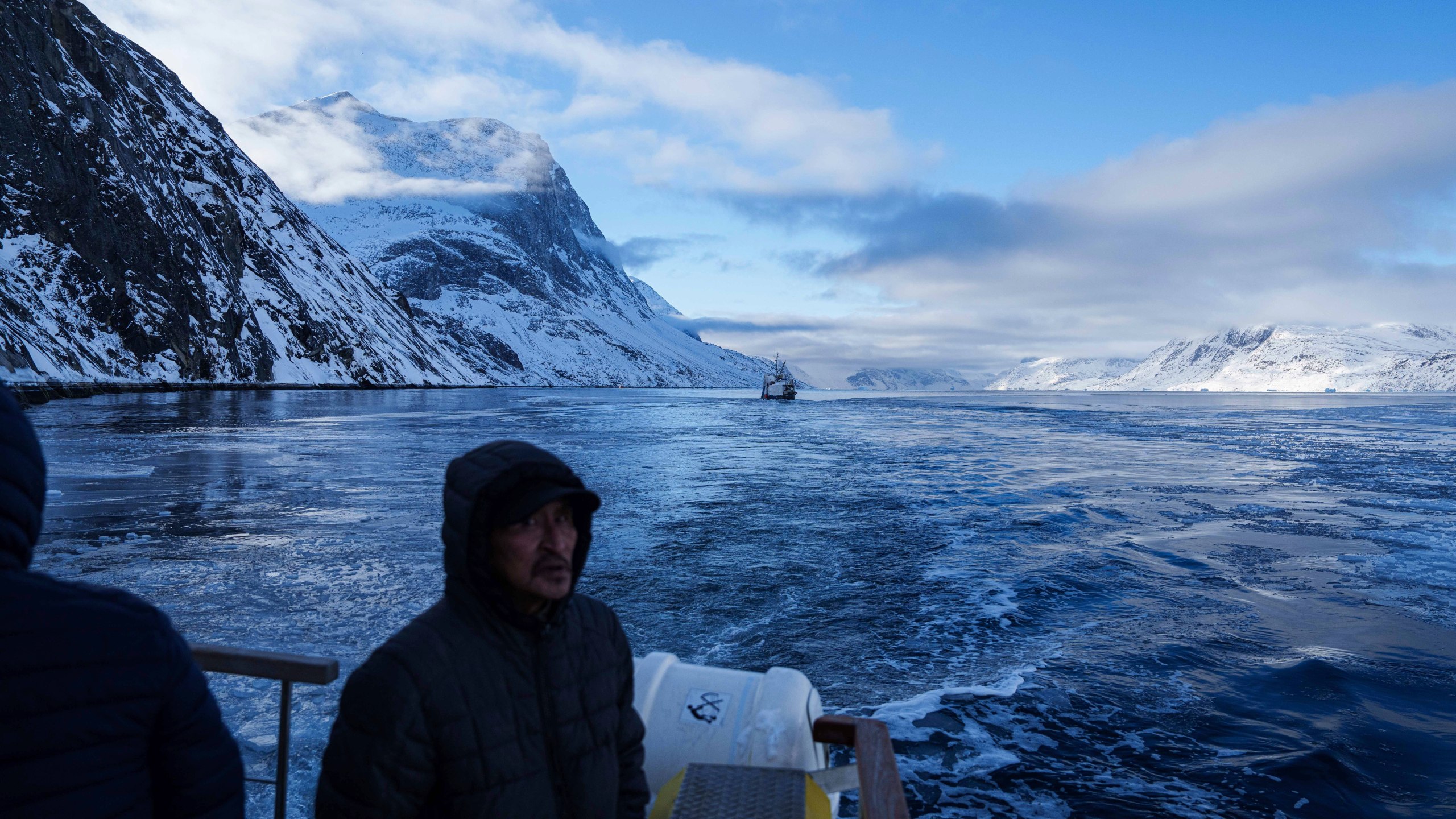 Passengers ride on a boat outside of Nuuk, Greenland, Thursday March 6, 2025. (AP Photo/Evgeniy Maloletka)