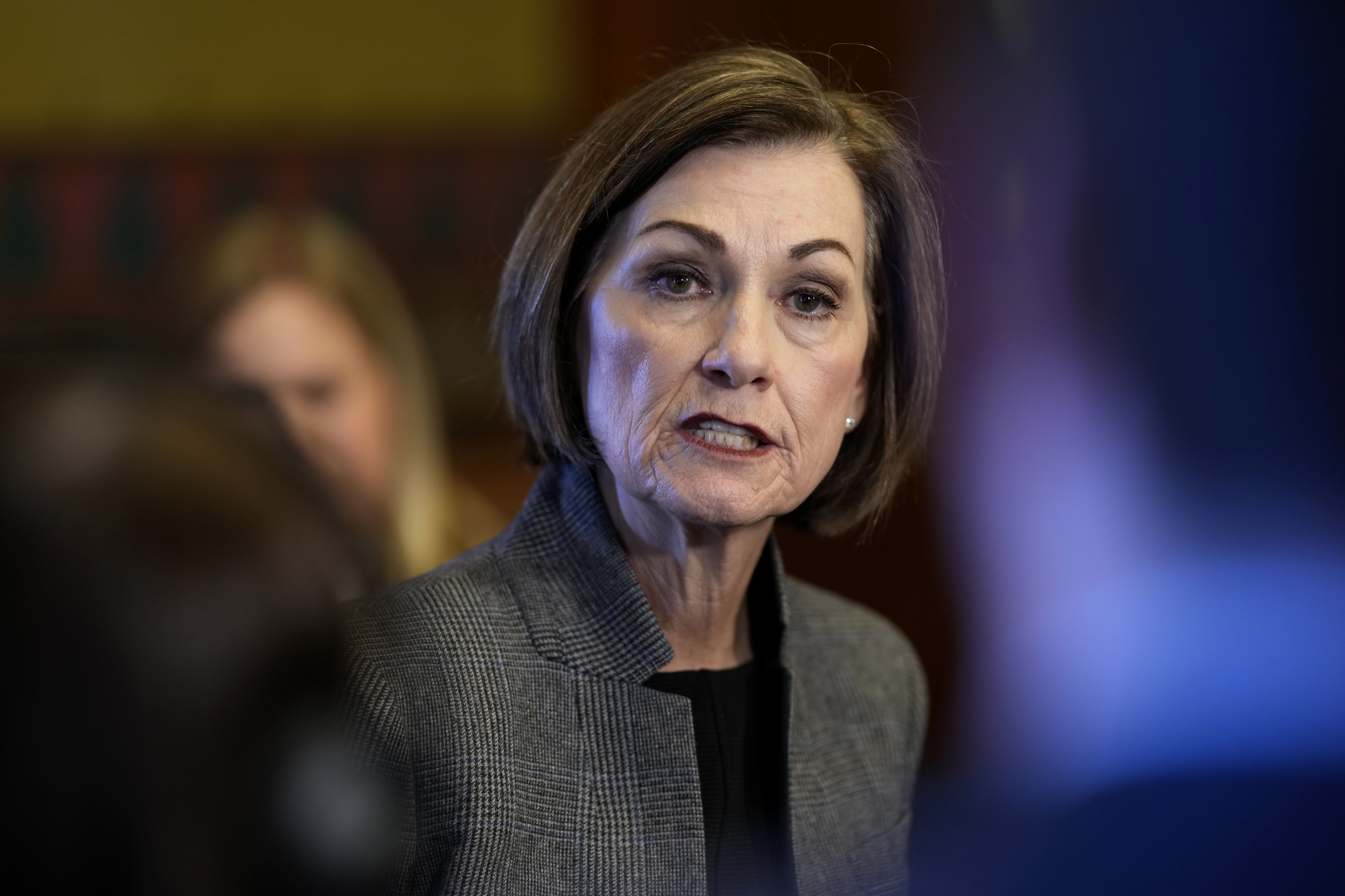 FILE - Iowa Gov. Kim Reynolds speaks during a news conference at the Statehouse in Des Moines, Iowa, Jan. 31, 2024. (AP Photo/Charlie Neibergall, File)